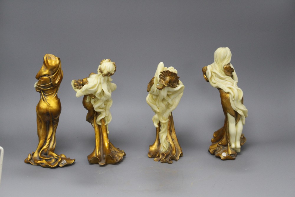 A set of four Italian gilt resin figures of maidens representing The Seasons, stamped STT, height 20cm